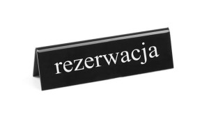 Tabliczka informacyjna stojąca "rezerwacja"